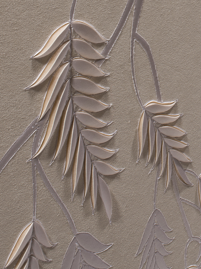 Detail of hand-sculpted white faux suede artwork by Helen Amy Murray with fern design with white silk crepe satin appliqué