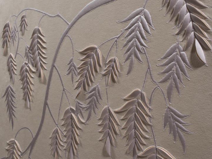 Detail of hand-sculpted white faux suede artwork by Helen Amy Murray with fern design with white silk crepe satin appliqué