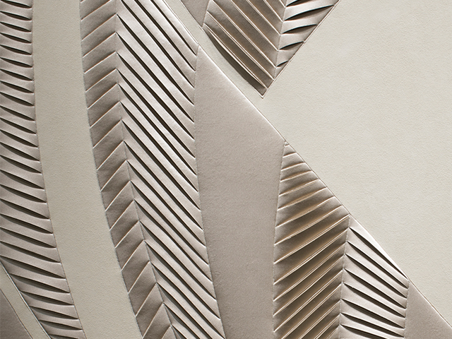 Detail of hand-sculpted artwork with herringbone design in taupe faux suede with taupe colour silk crepe satin