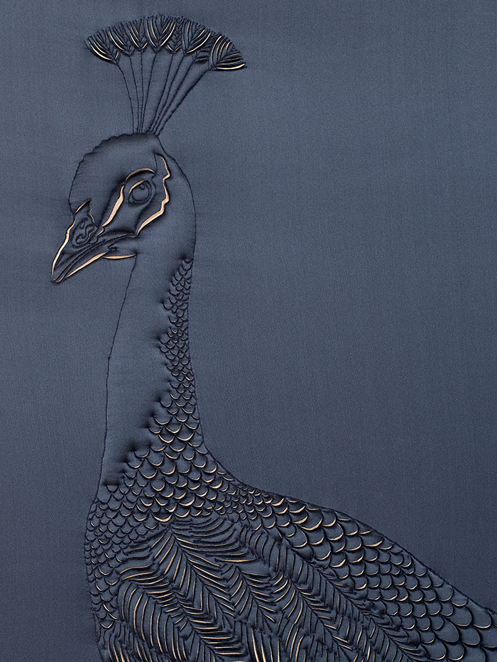 Artwork showing a detail of Peacock's head, hand-sculpted in navy blue and gold silk crepe satin and douppion silk appliqué