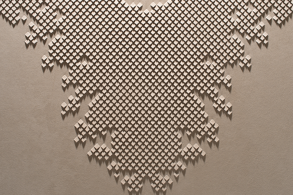 Close-up of Pixelated artwork by Helen Amy Murray, hand-sculpted in white faux suede