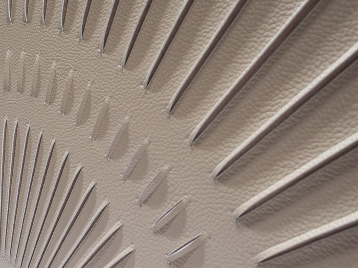 Detail of Radial artwork by Helen Amy Murray, hand-sculpted in taupe faux leather