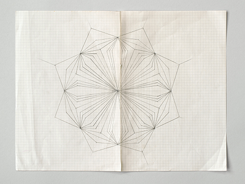 Photograph of a geometric pencil drawing by Helen Murray on graph paper on a grey background