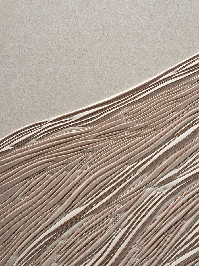 Detail of hand-sculpted artwork of a sand dune by Helen Amy Murray in cream faux suede