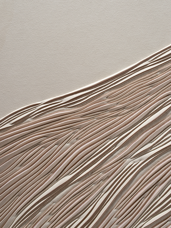Detail of hand-sculpted artwork of a sand dune by Helen Amy Murray in cream faux suede