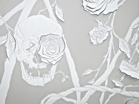 Detail of Skulls & Roses artwork, hand-sculpted in white vegetable tanned leather and reflective white fabric appliqué