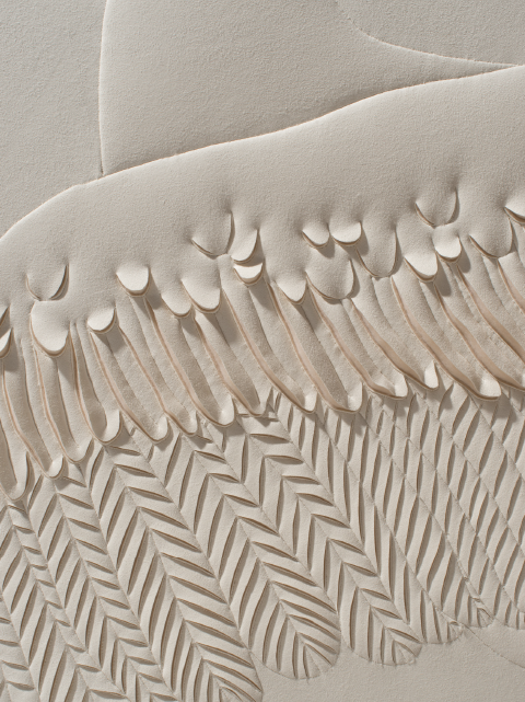 Detail of a hand-sculpted artwork by Helen Amy Murray of a swan showing wing feathers and neck in a cream colour faux suede