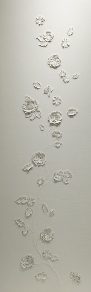 A pair of hand-sculpted white leather artworks by Helen Amy Murray featuring three-dimensional wild roses on a branch